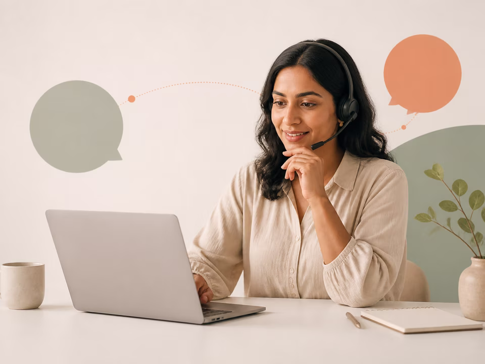 An adult support specialist helping from a laptop with abstract conversation shapes